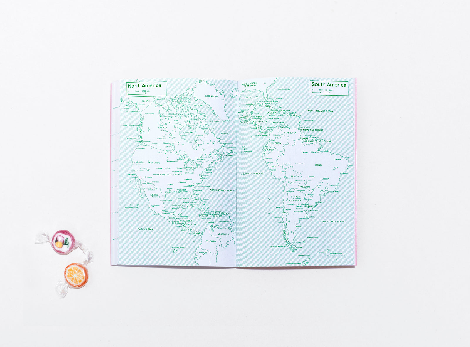 layout of the planner 2024 me & us, green ink on white, world maps, with bonbons on the side