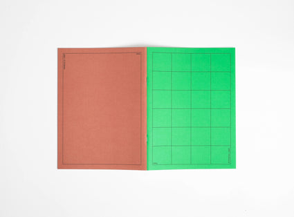 one brown and green notebook booq on a white background