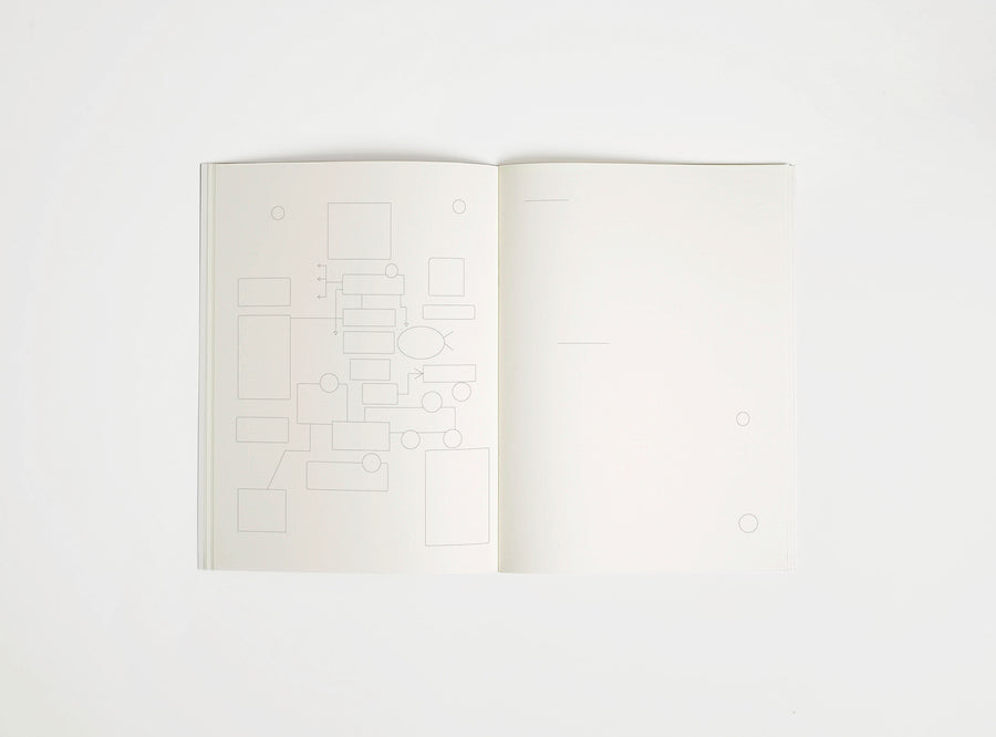 Open notebook edition julie joliat x studio playground with white pages on a white background, with scribbles printed on it.