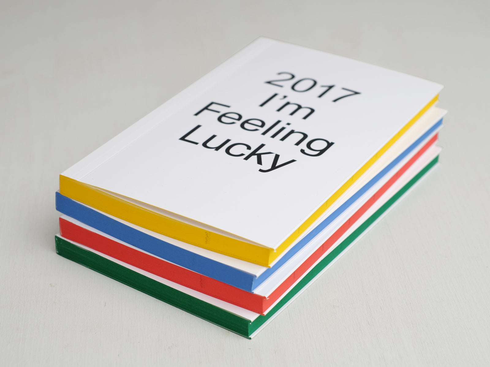 Planner from 2017 with white cover and coloured side pages in yellow, blue, red and green.