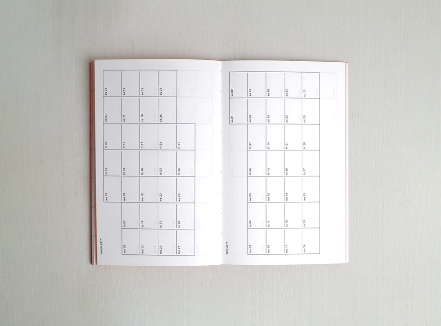 Spread from our white planner from 2017 which motto was I'm Feeling Lucky. This spread shows two calendars grids.
