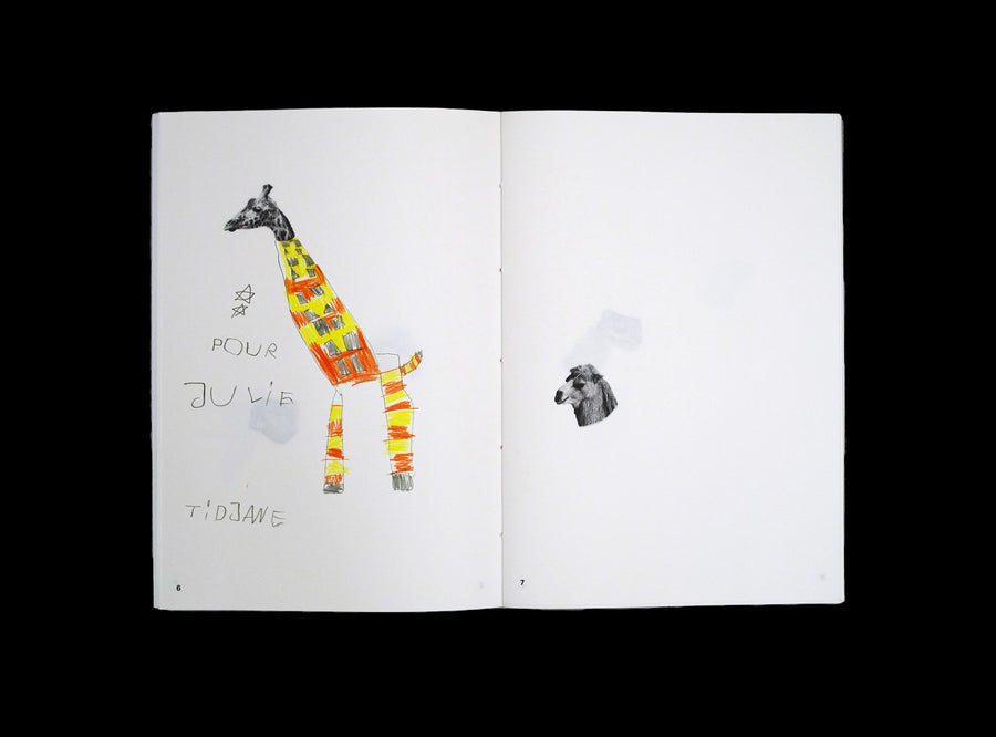 Spread from our Animal Drawing notebook with children drawing.