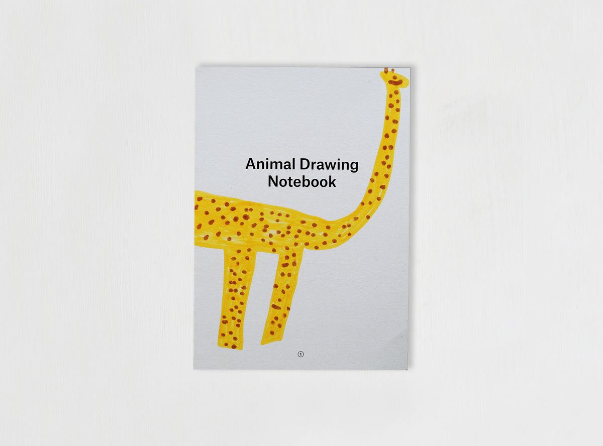 Cover from our Animal Drawing notebook with children drawing of a giraf
