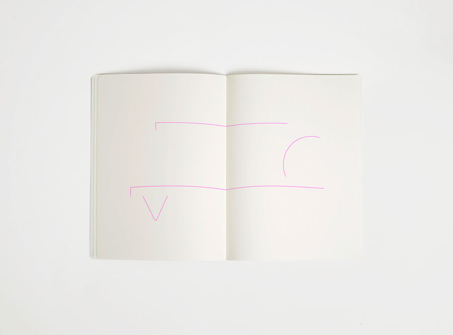 Open notebook with a pink drawing suggesting Memphis Big Sur Sofa on white background, the iconic design piece