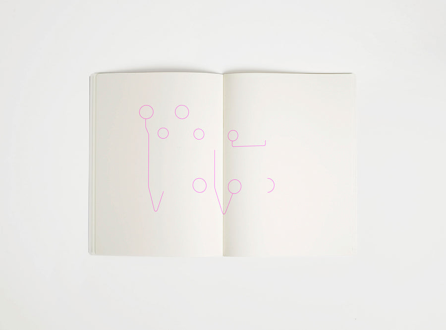 Open notebook with a pink drawing suggesting Eames Hang it All on white background, the iconic design piece