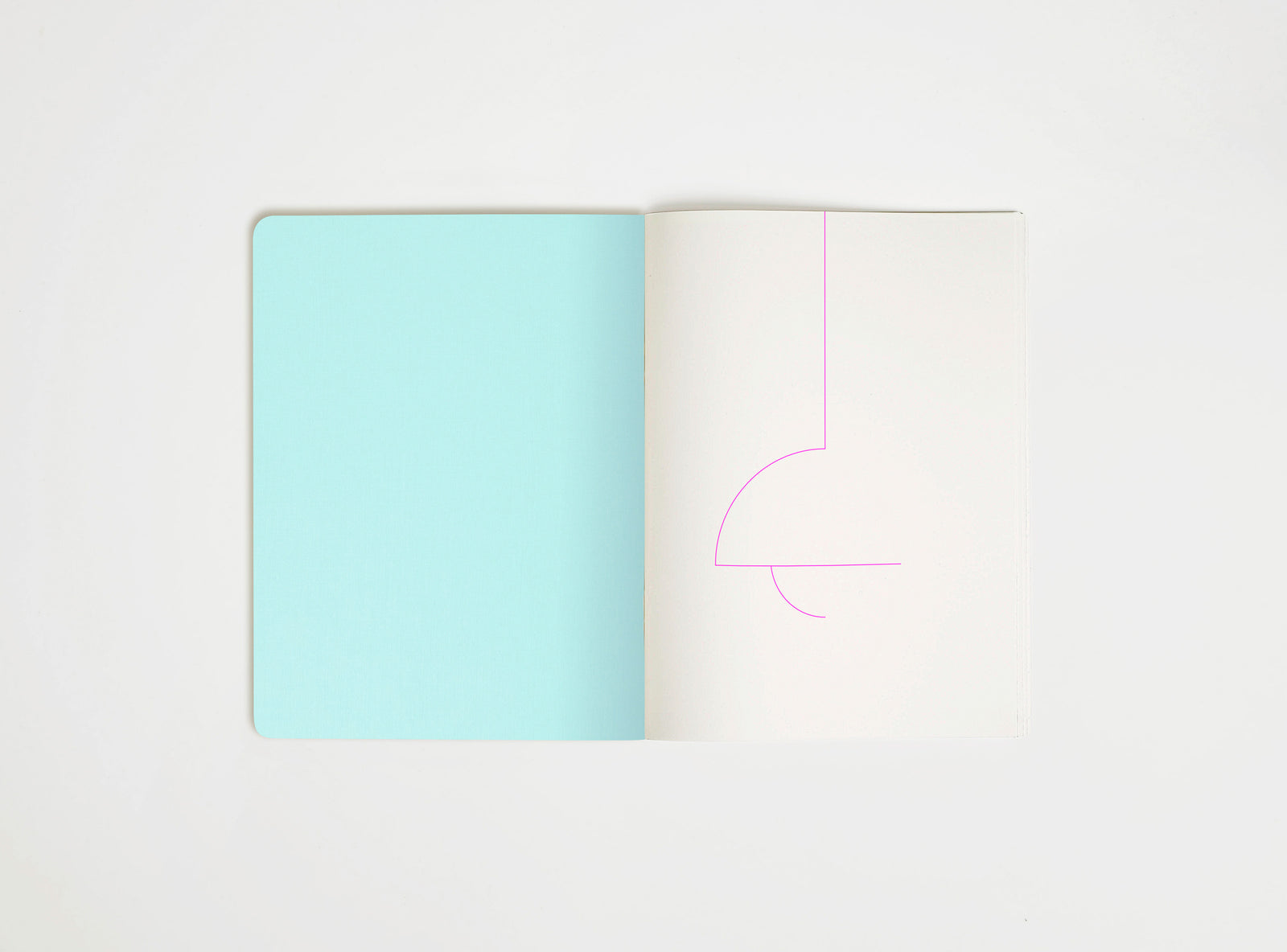 Open book with a light blue page and pink line drawing on a white background, drawing suggesting flowerpot lamp from panton,  the iconic design piece