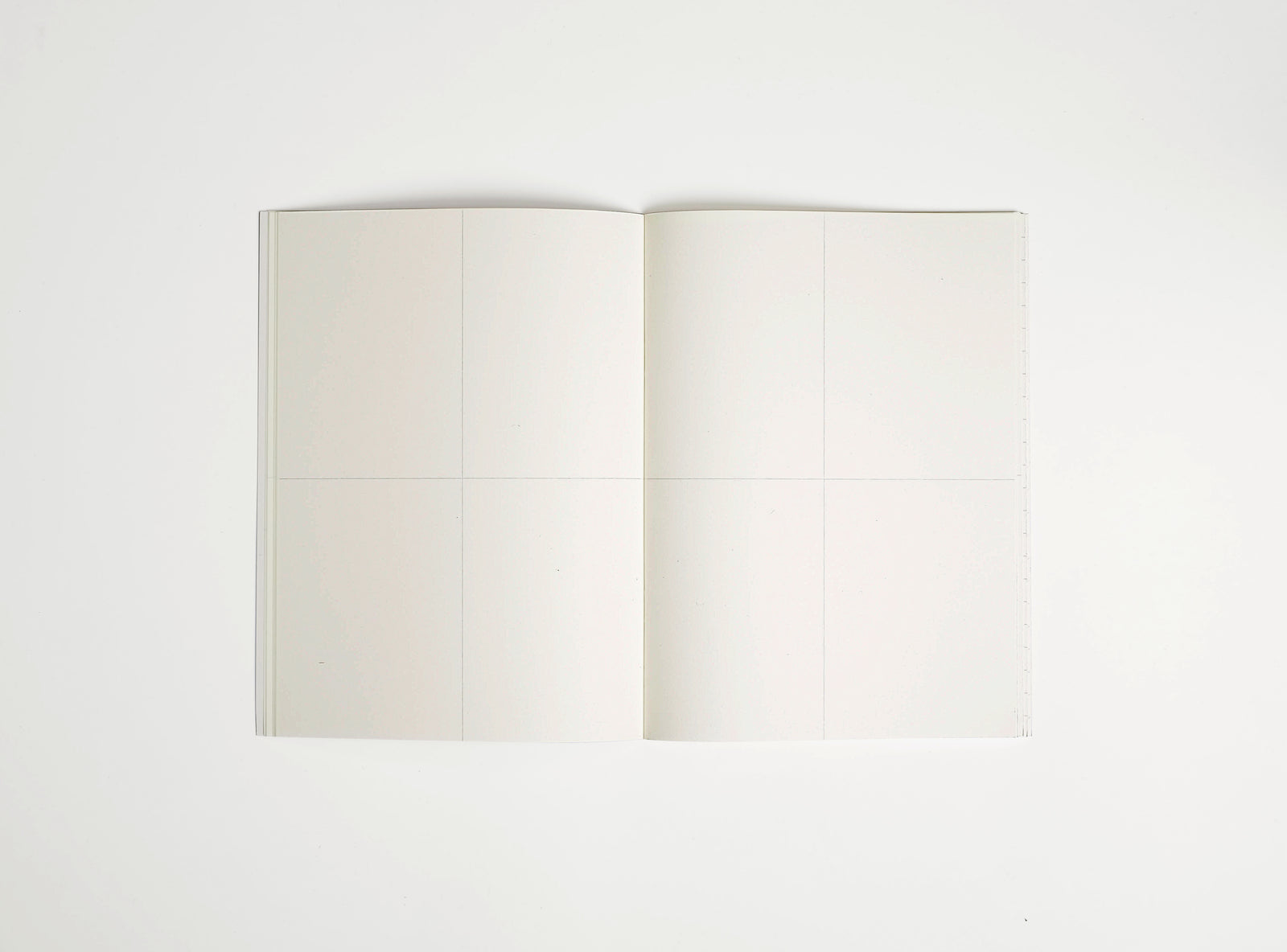 softover notebook booq spread with 2x2 frames per page on white background