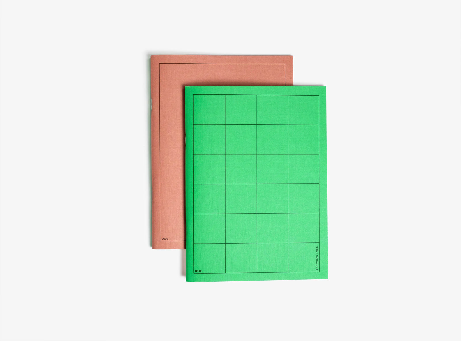 green and brown softcover notebook booq on white background