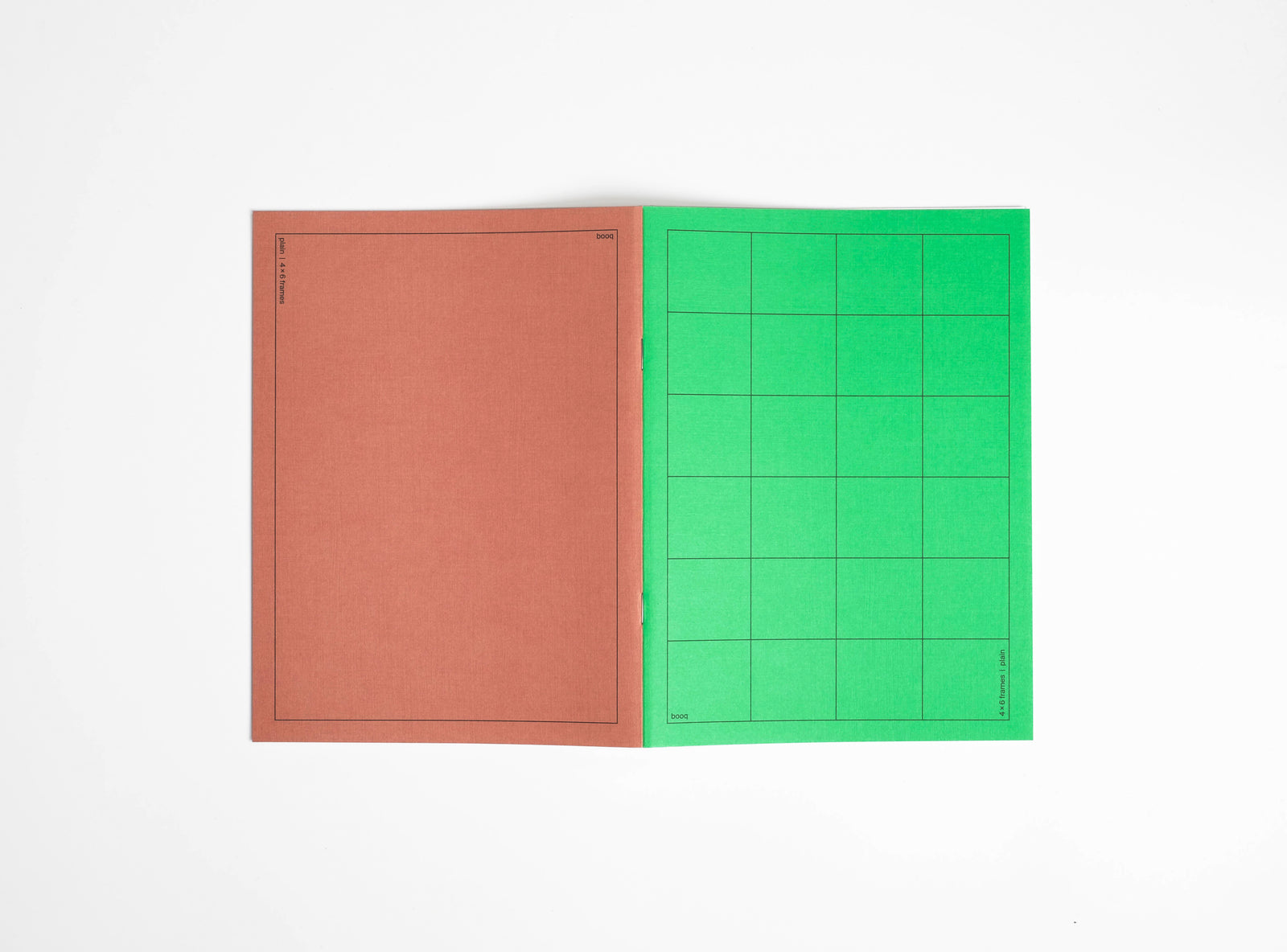 one brown and green notebook booq on a white background