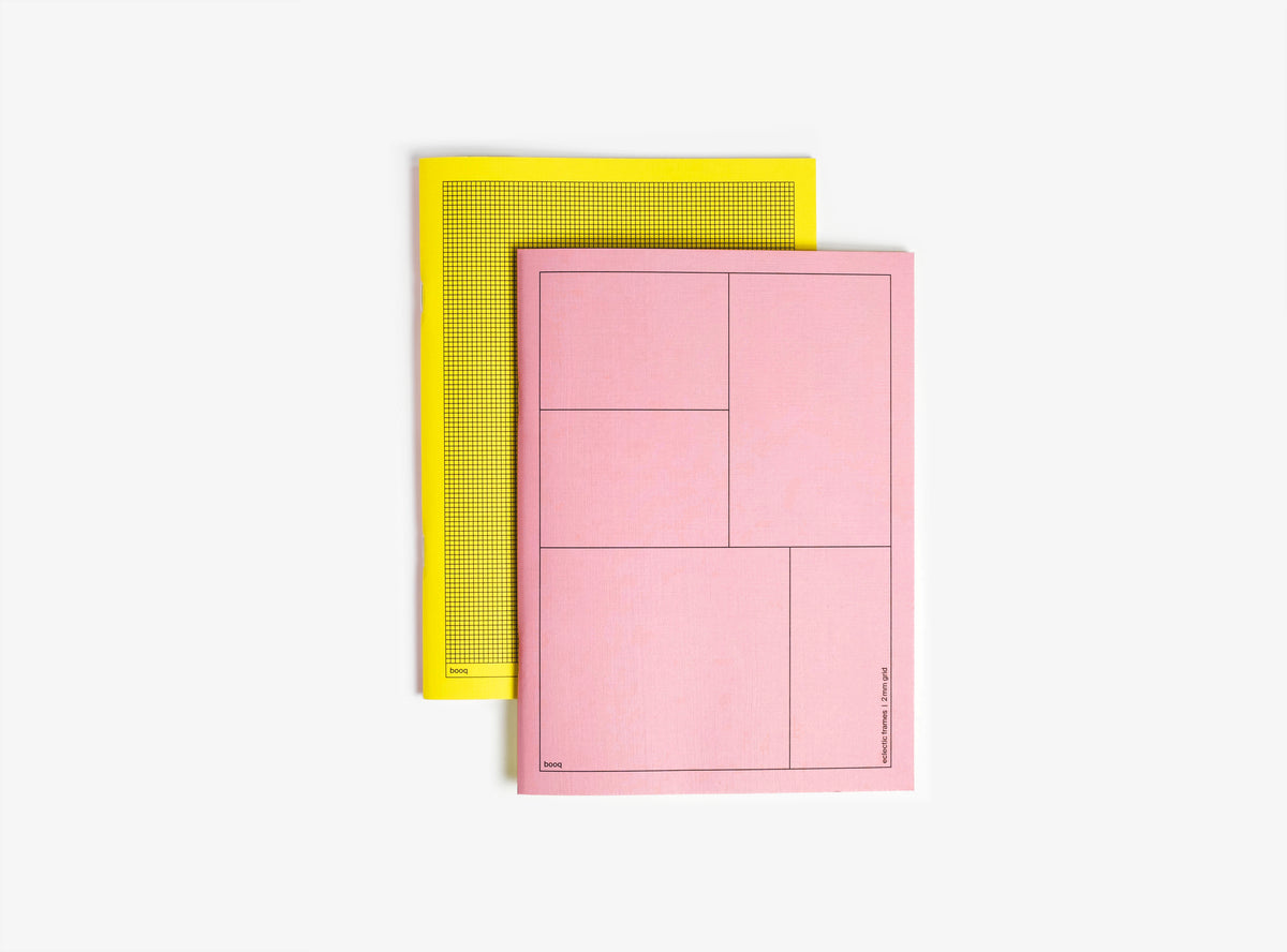 pink and yellow softcover notebook booq on white background