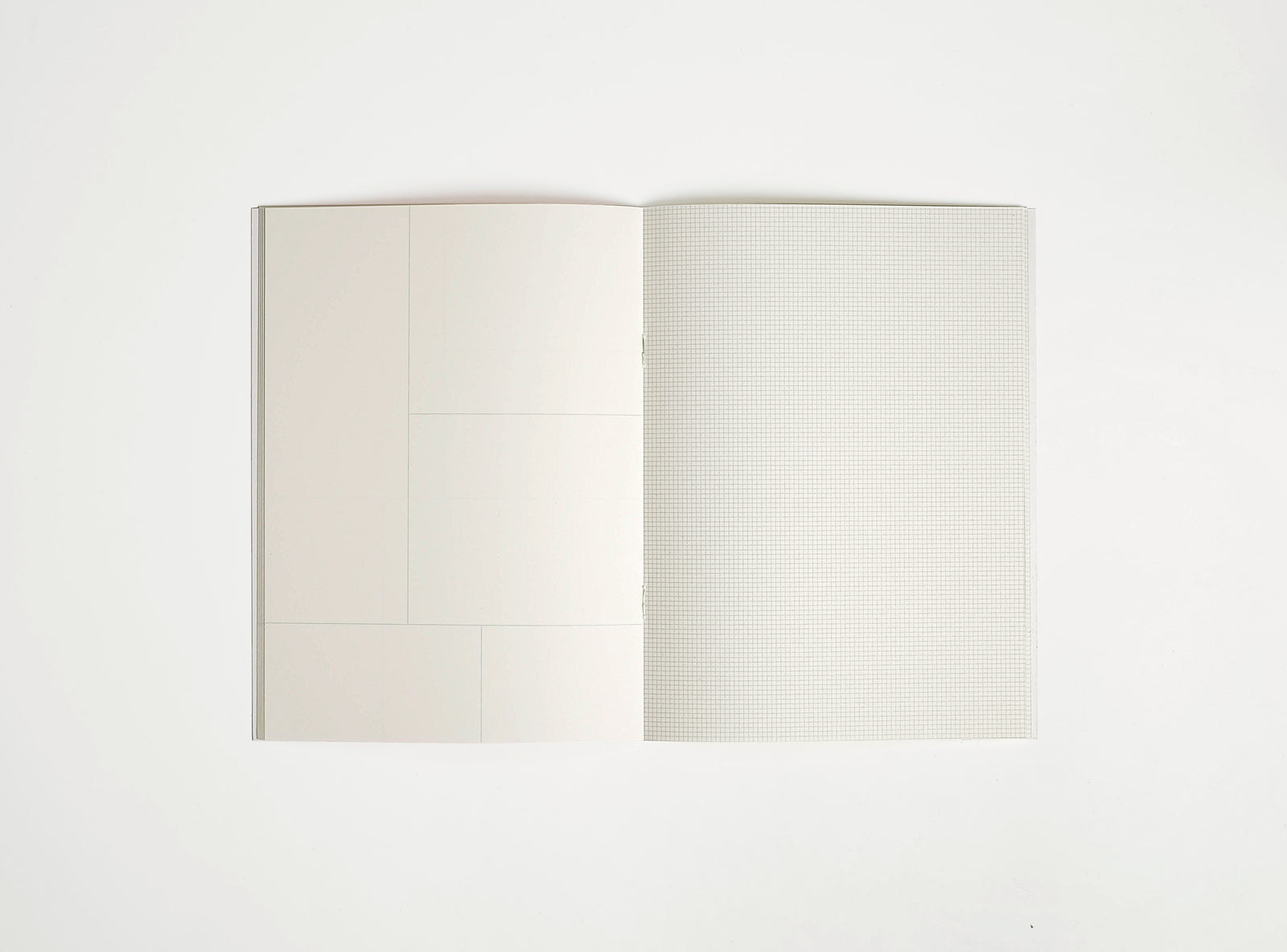 softover notebook booq open in the middle on white background, 2 mm grid print inside + frames