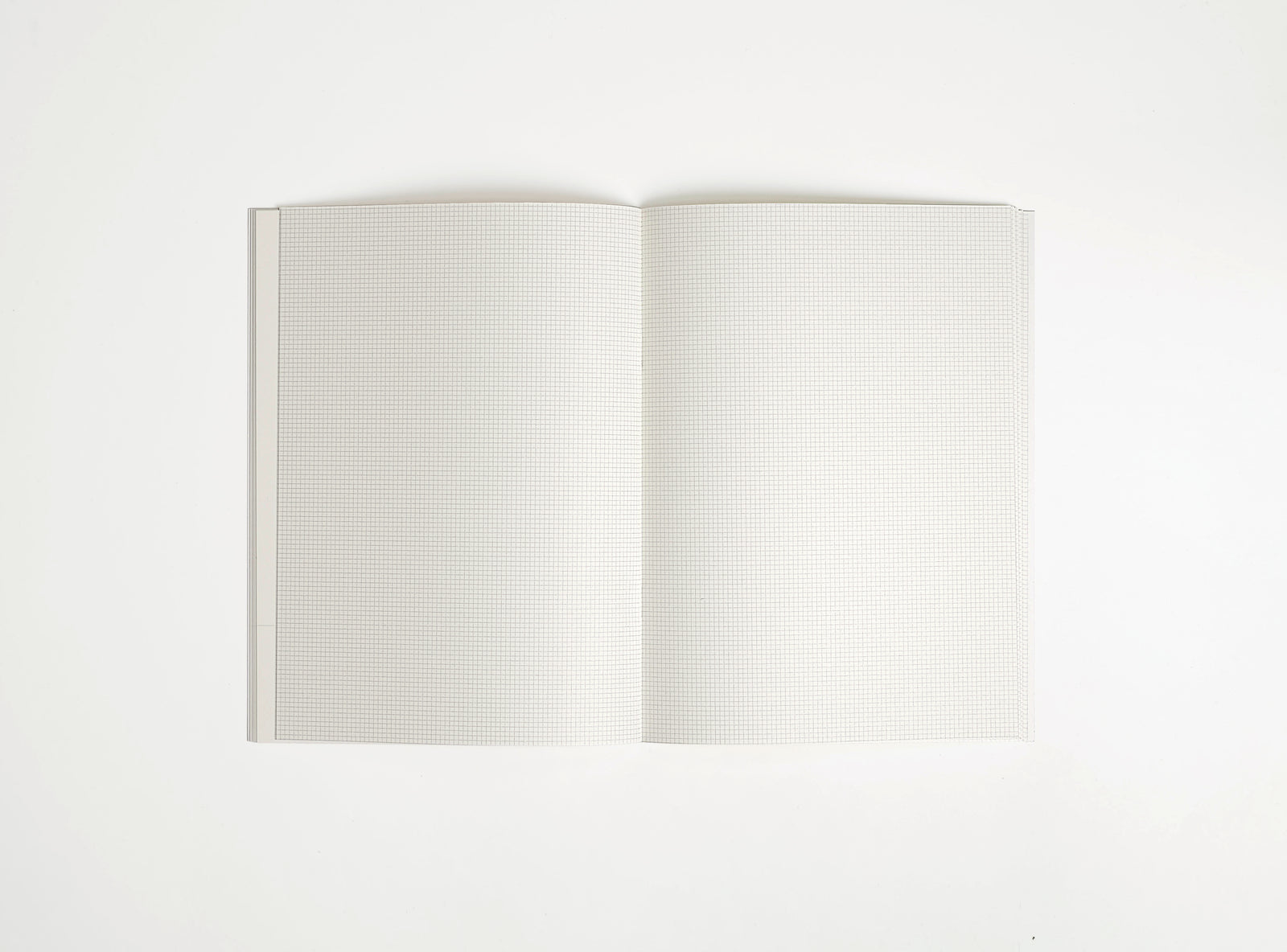 picture of softover notebook booq open on white backround, 2 mm grid print inside