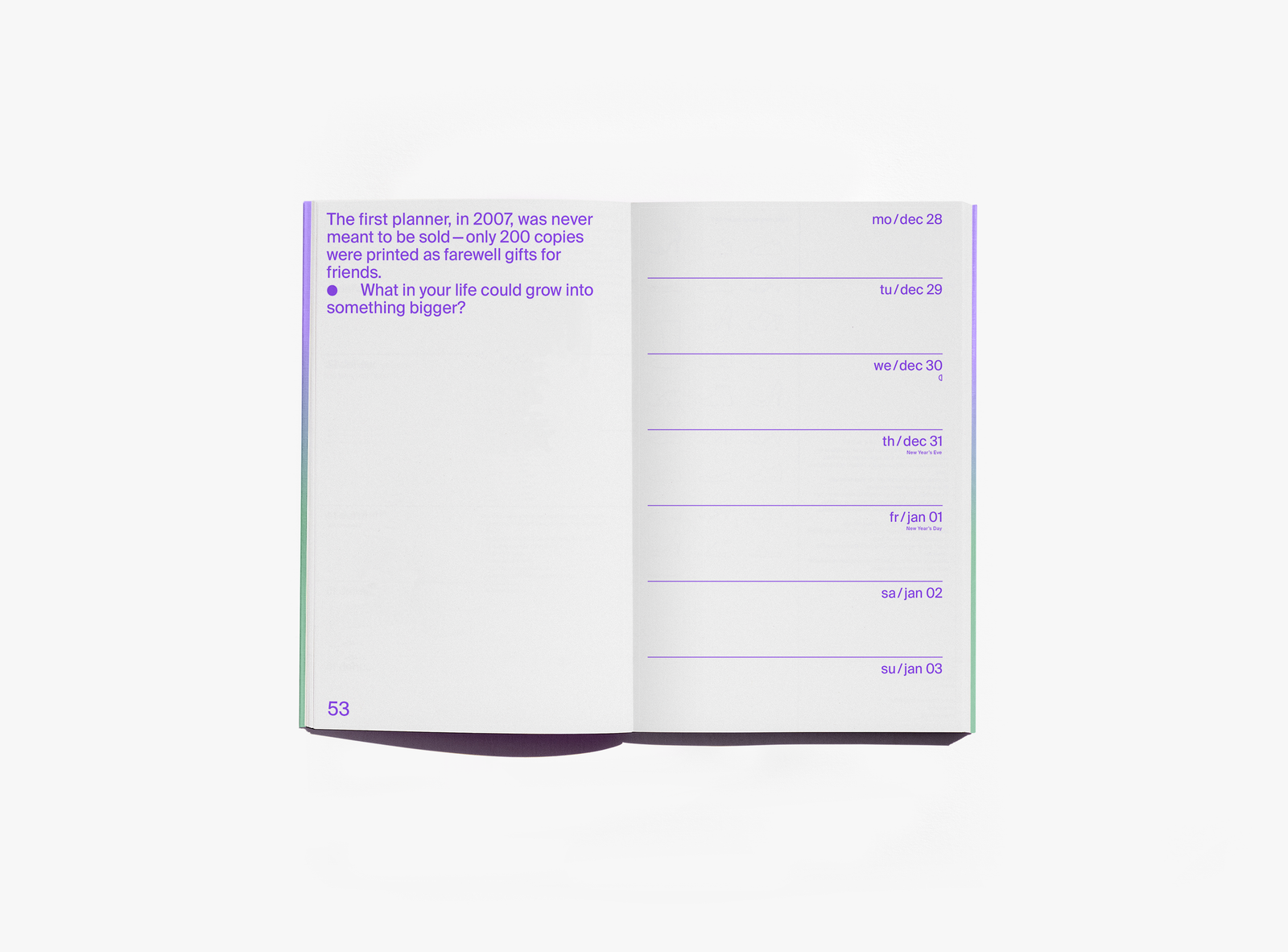 An open edition julie joliat planner agenda 2027 showing a page with purple text on the left and a weekly schedule layout on the right, photographed on a clean white background.