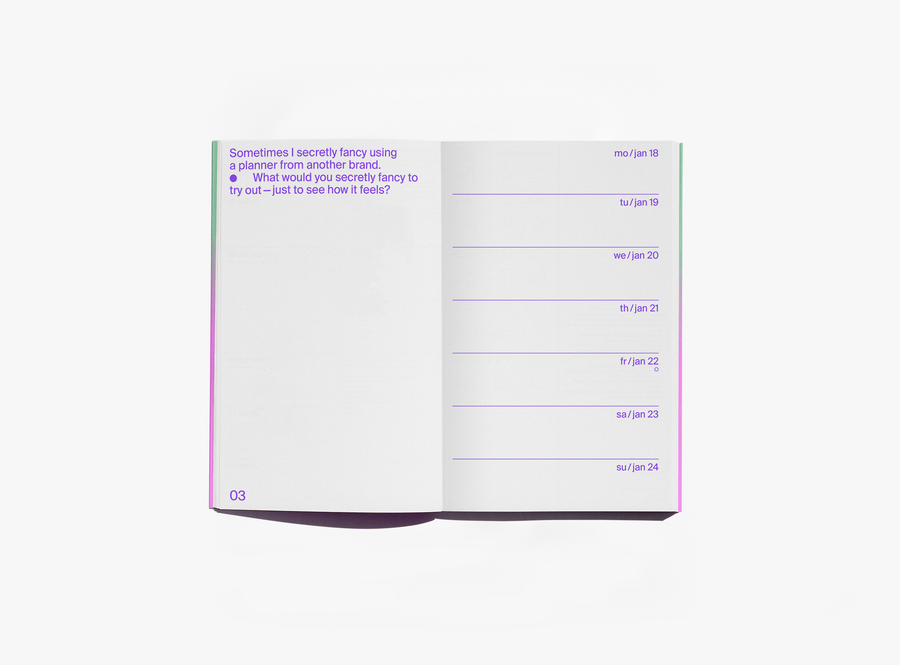 An open edition julie joliat planner agenda 2027 showing a page with purple text on the left and a weekly schedule layout on the right, photographed on a clean white background.