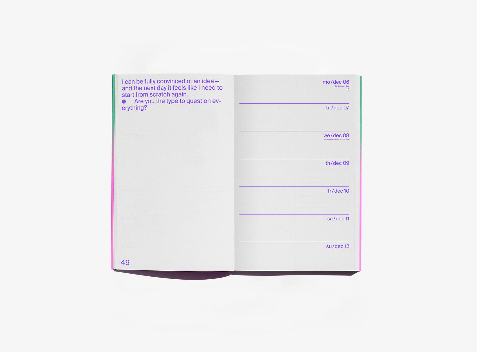 An open edition julie joliat planner agenda 2027 showing a page with purple text on the left and a weekly schedule layout on the right, photographed on a clean white background.