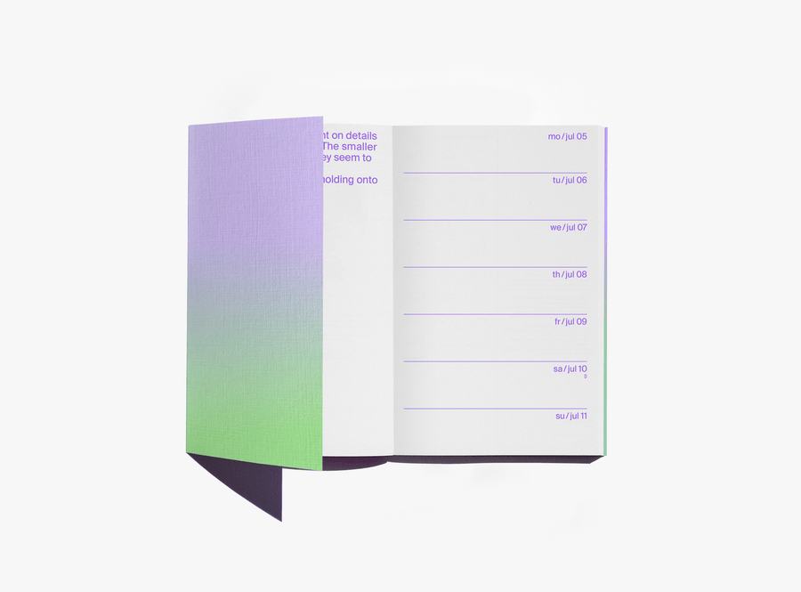 edition julie joliat planner agenda 2027 'once upon today' open with purple text inside and gradient flap — on a white background.
