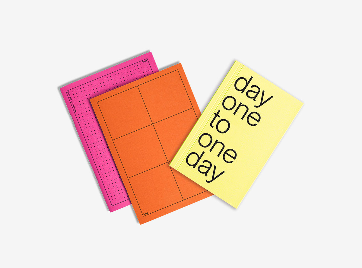 One notebooks with different colored covers and planner 2026  on a white background