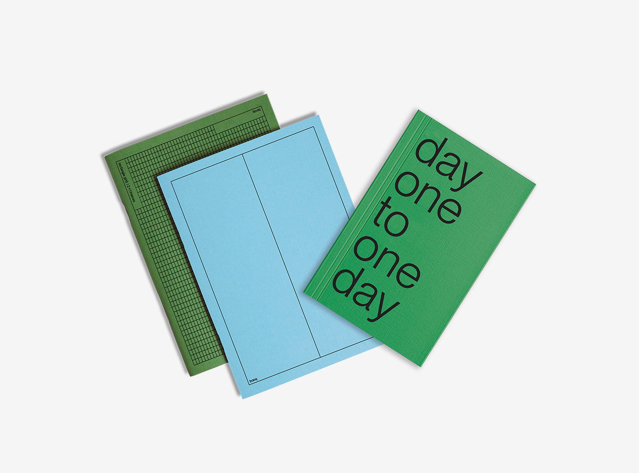 One notebooks with different colored covers and planner 2026  on a white background