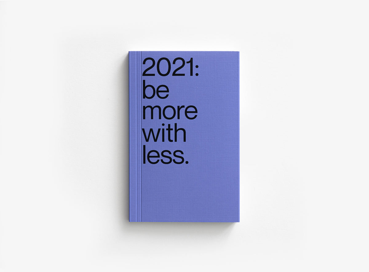 Violet cover of our 2021 planner which motto was be more with less.