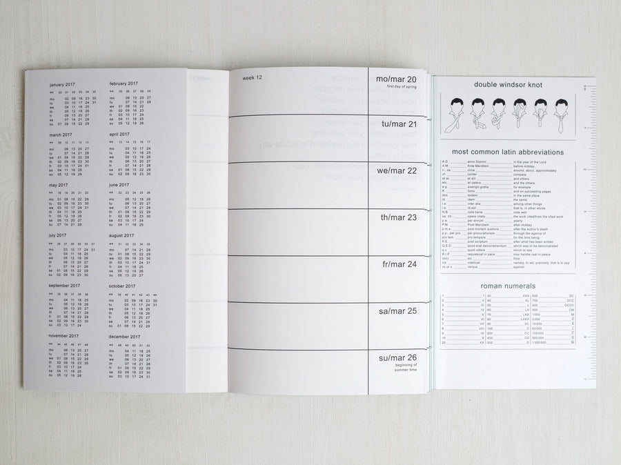 Planner from 2017 with bandanas opened showing the calendar part and other details such as how to make a double Windsor knot, latin abbreviations and roman numerals.