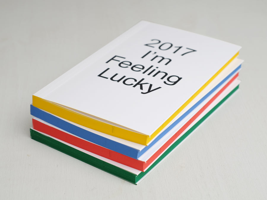 Planner from 2017 with white cover and coloured side pages in yellow, blue, red and green. 